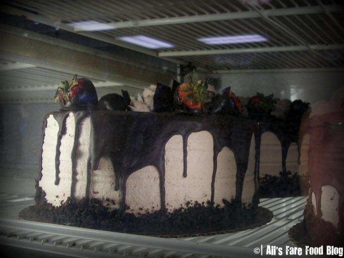 Chocolate cake in a display fridge at Mike's Pastries