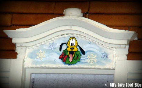 Pluto over one of the windows on the gingerbread house